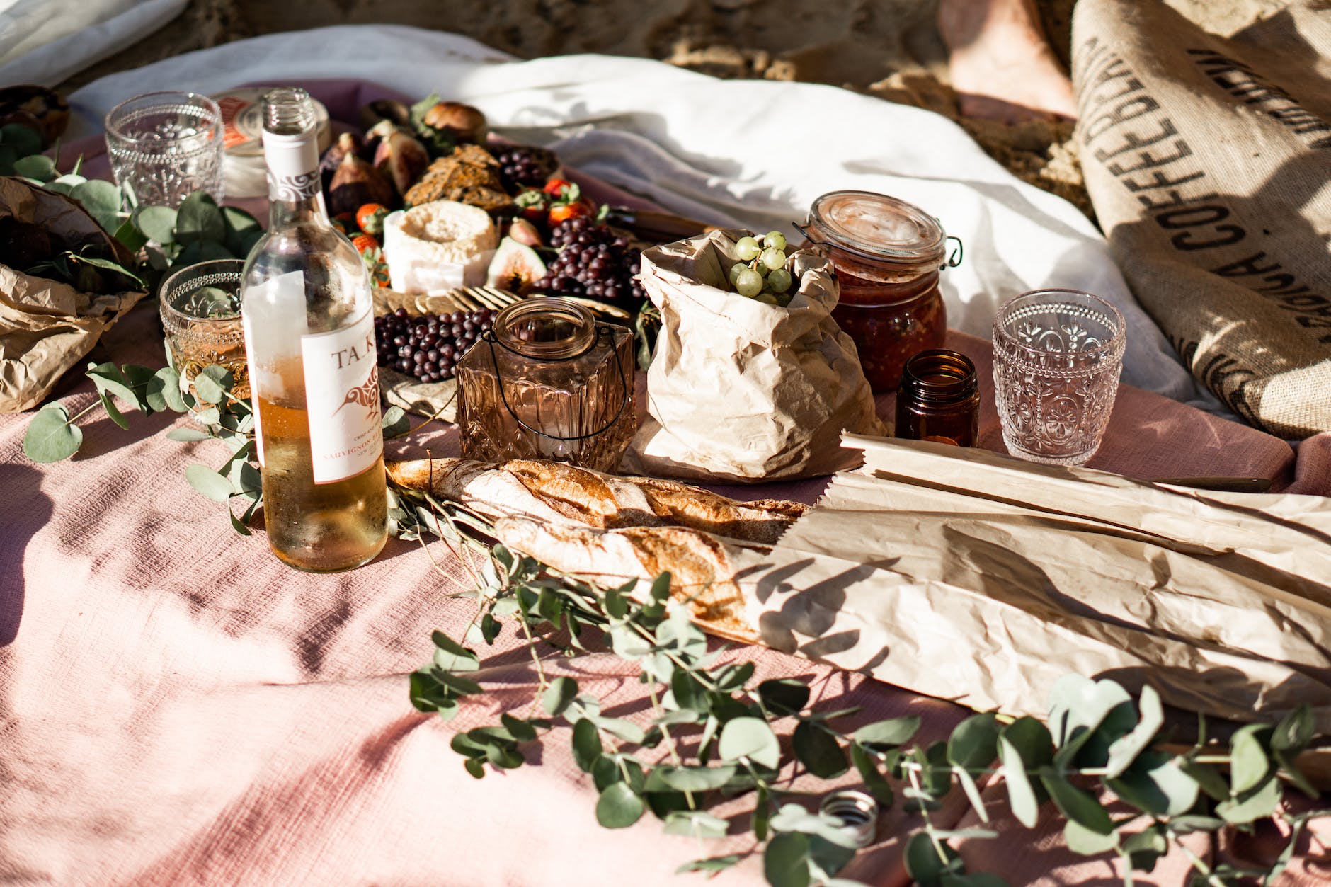 labeled glass bottle beside food spring date night