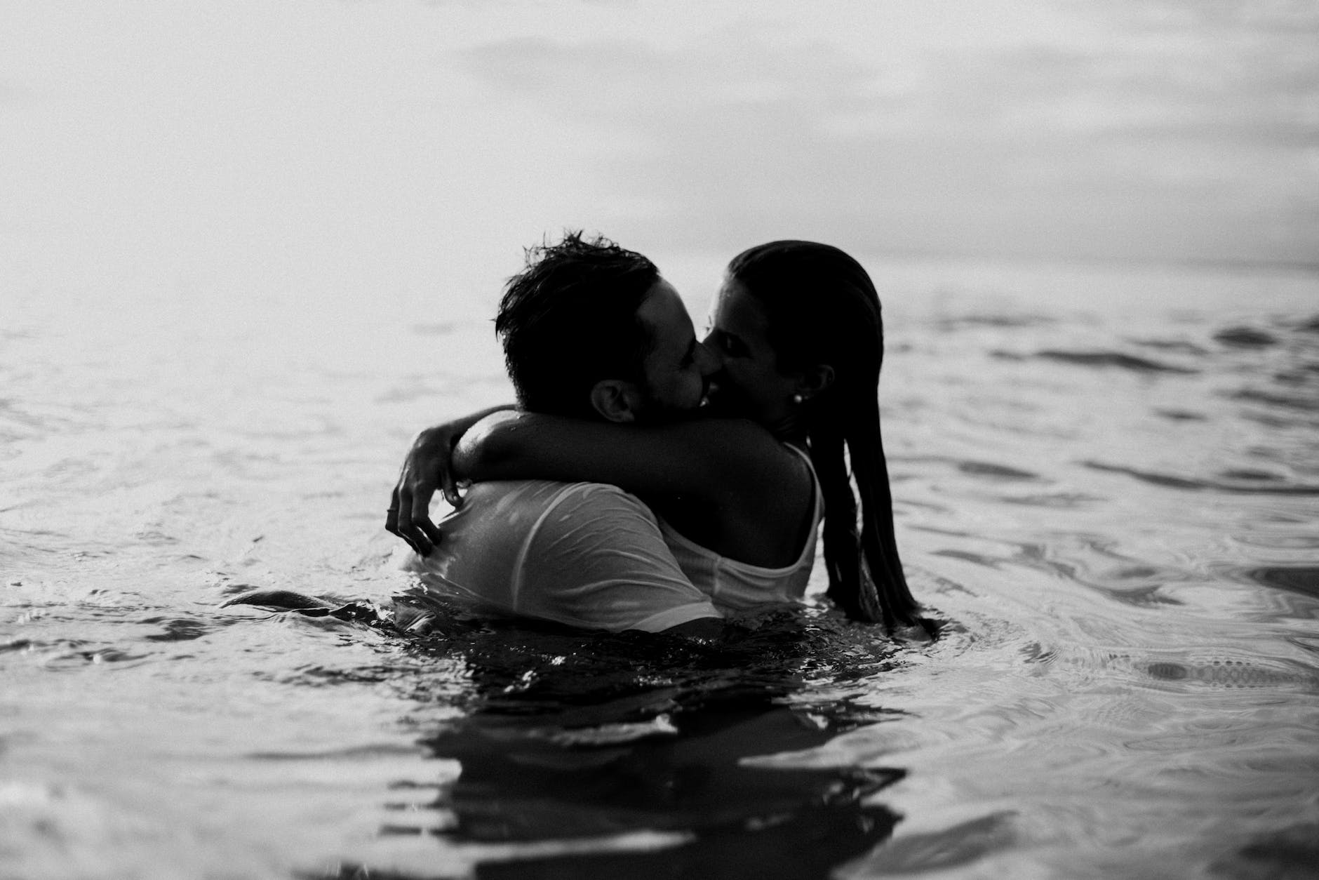 man and woman kissing together on body of water - Boost Your Libido and Enhance Your Sexual Health