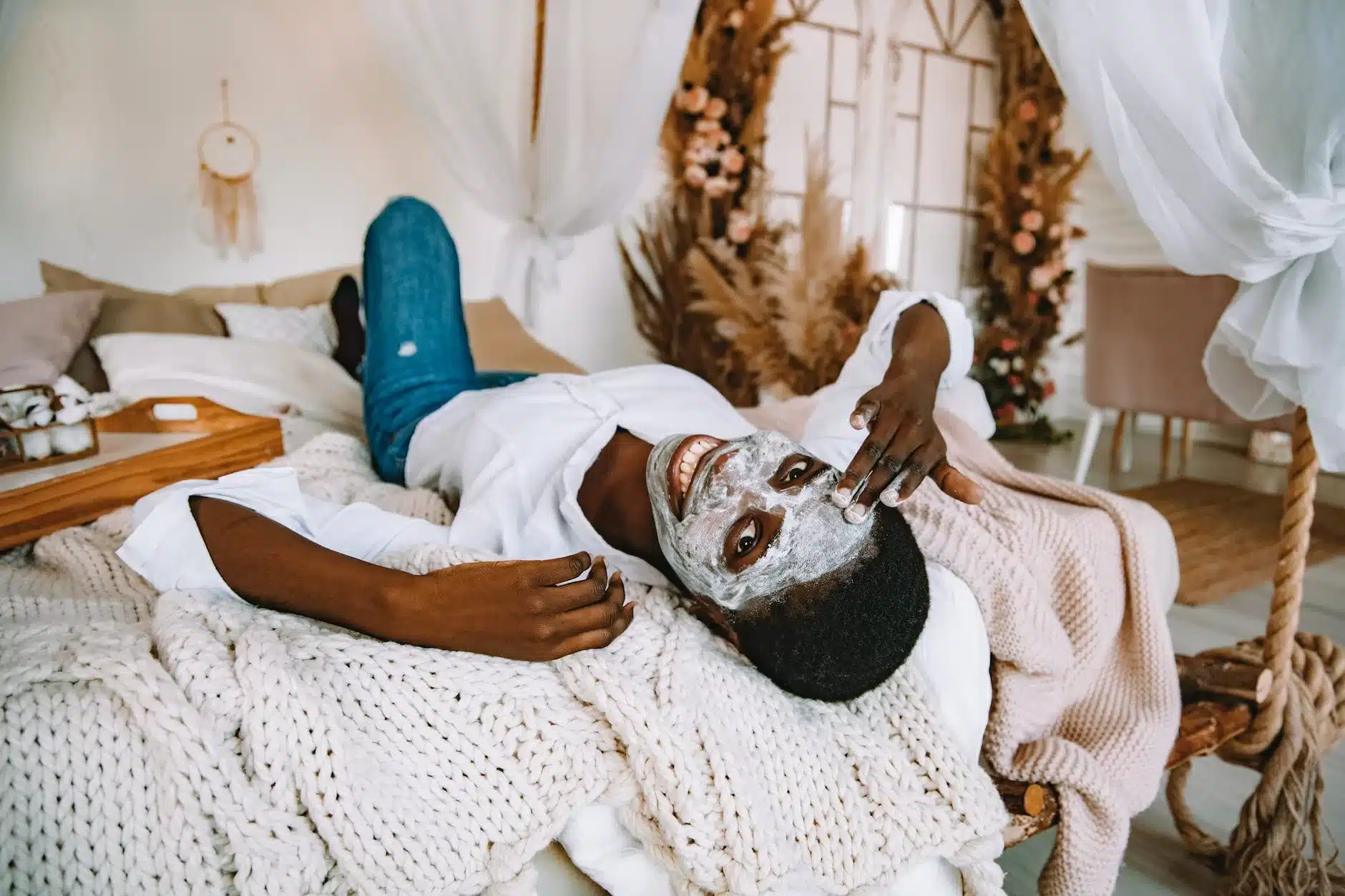 woman putting on cleansing face mask for dull skin